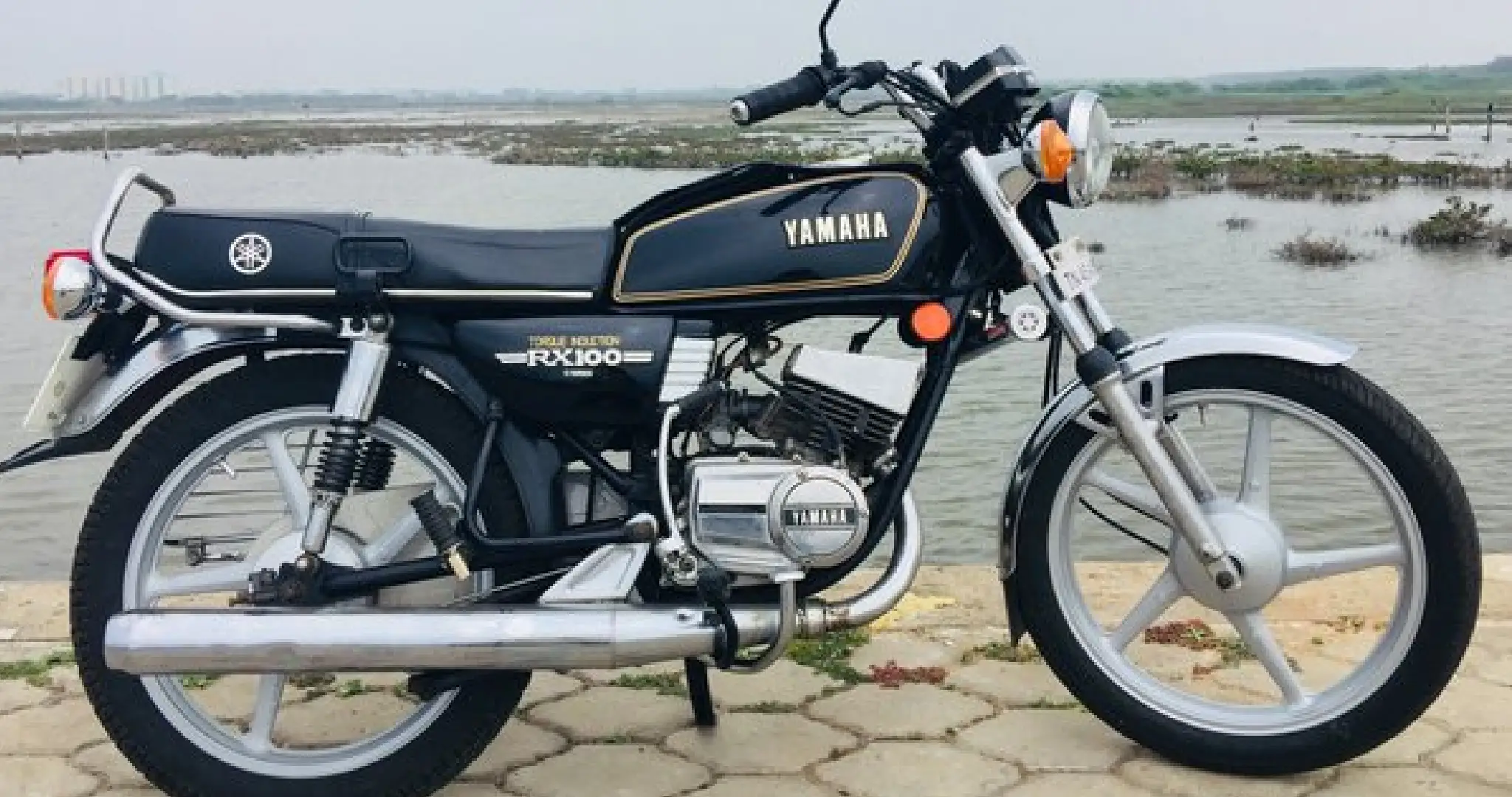 https://www.google.com/url?sa=i&url=https%3A%2F%2Fpune.news%2Fauto%2Frevving-back-to-glory-yamaha-rx-100-makes-a-dazzling-comeback-with-exciting-features-117437%2F&psig=AOvVaw1AAUK0O80XEQMUx_j4ZDM-&ust=1738157350320000&source=images&cd=vfe&opi=89978449&ved=0CBQQjRxqFwoTCODMk-_CmIsDFQAAAAAdAAAAABAR